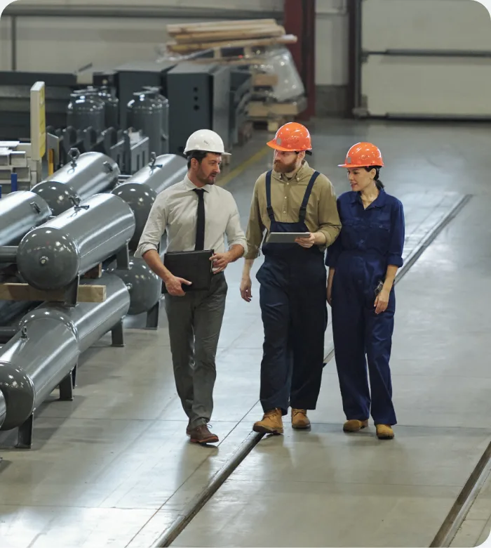 Toplink buyers walking a factory floor with a client